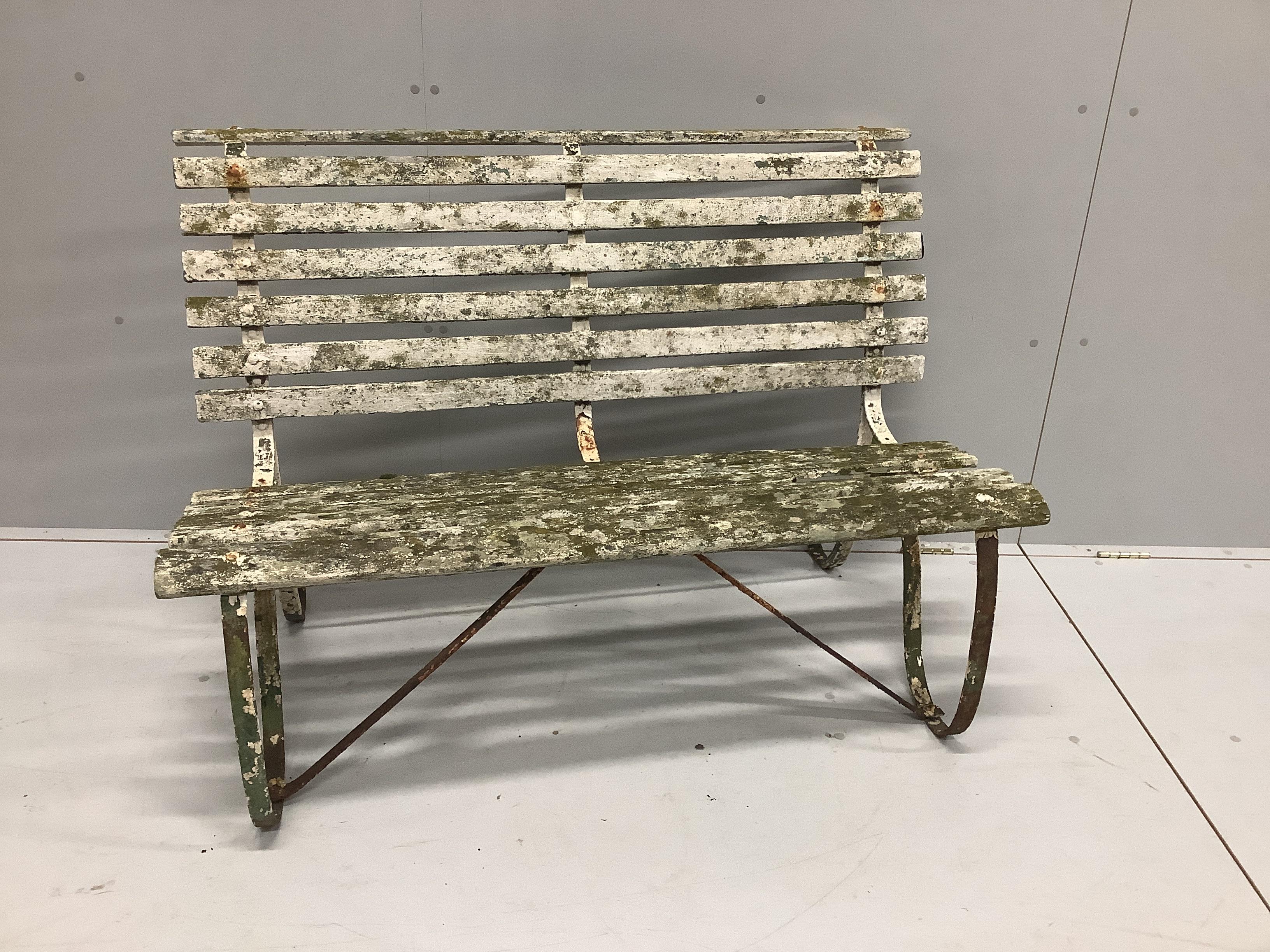 A small slatted wrought iron garden bench, width 122cm, depth 68cm, height 85cm